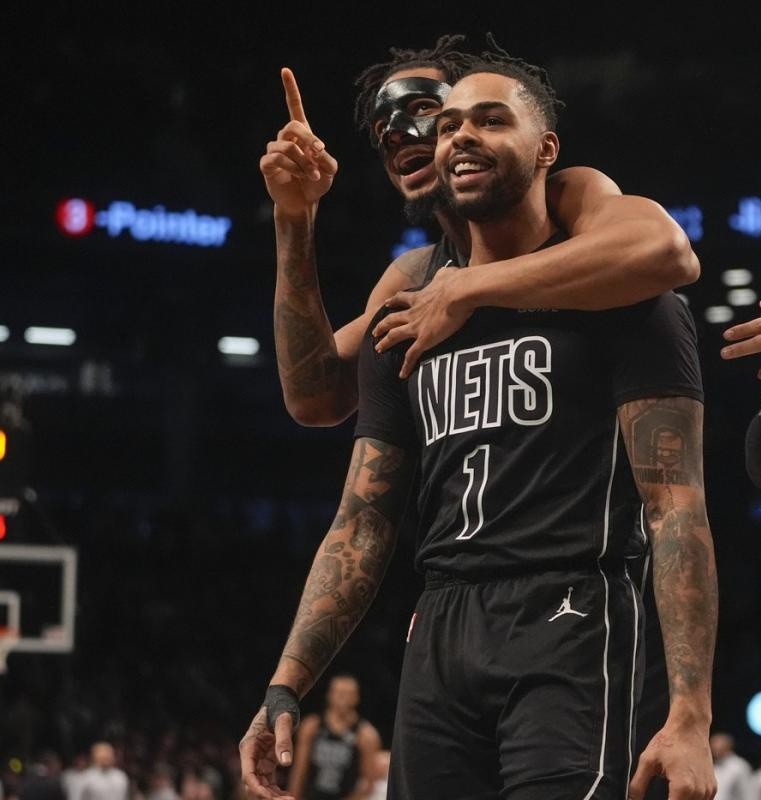 View from courtside floor seats at the Barclays Center for a Brooklyn Nets game, a premier VIP sports experience for charity galas.
